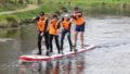 Pratiquants de Sup sur le canal sur une Sup multiple.